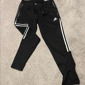 Adidas Wens Black Sweatpants with White Accents and zipper at at shoe end